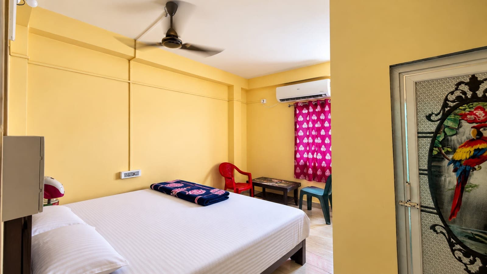 Executive double bedroom with clean white sheets at Anandamoyee Guest House